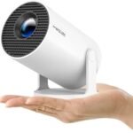 Upgrade your entertainment with this portable Mini Projector featuring WiFi, Bluetooth, built-in streaming apps, 1080P HD support, and a massive 130-inch display. Perfect for home theaters, outdoor movie nights, gaming, presentations, and streaming from smartphones, laptops, TV sticks, HDMI, and USB devices.